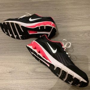 Black, pink, and white Nike Reax Run 3